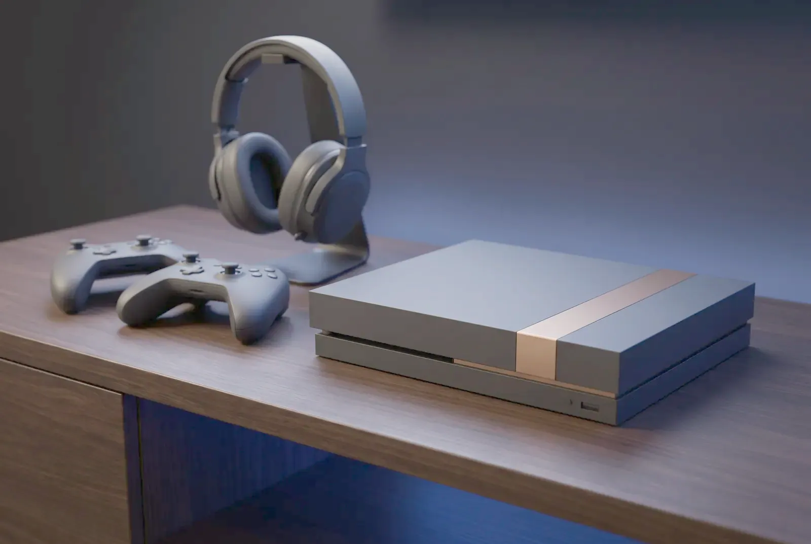 A game console standing beside two wireless controllers and a headset