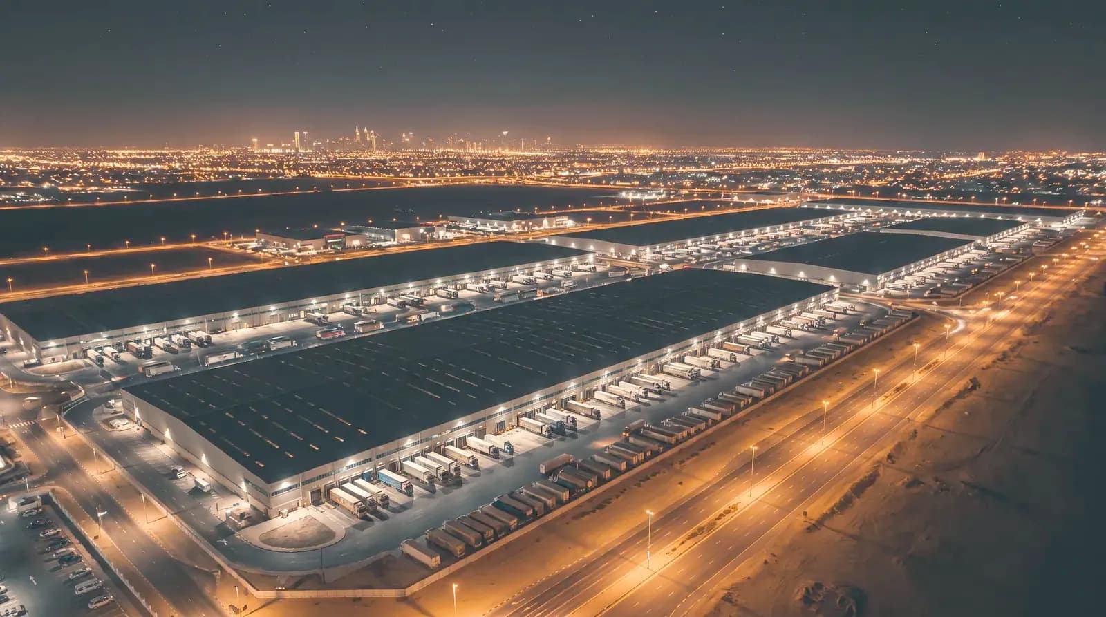 Aerial view of a Gulf logistics free zone at night