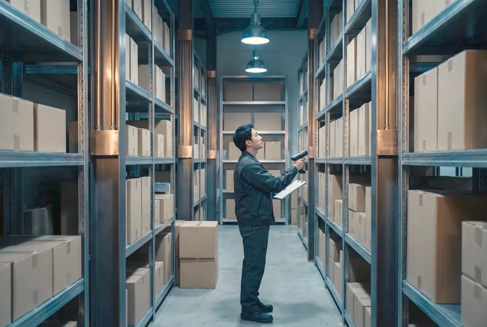 Staff checking stock quantities with a scanner