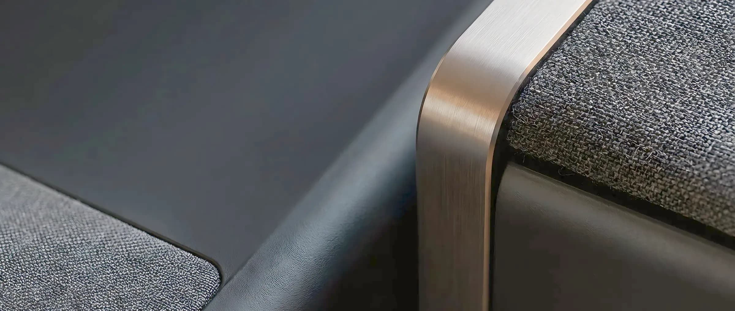 Close detail of aluminium, matte plastic and speaker fabric