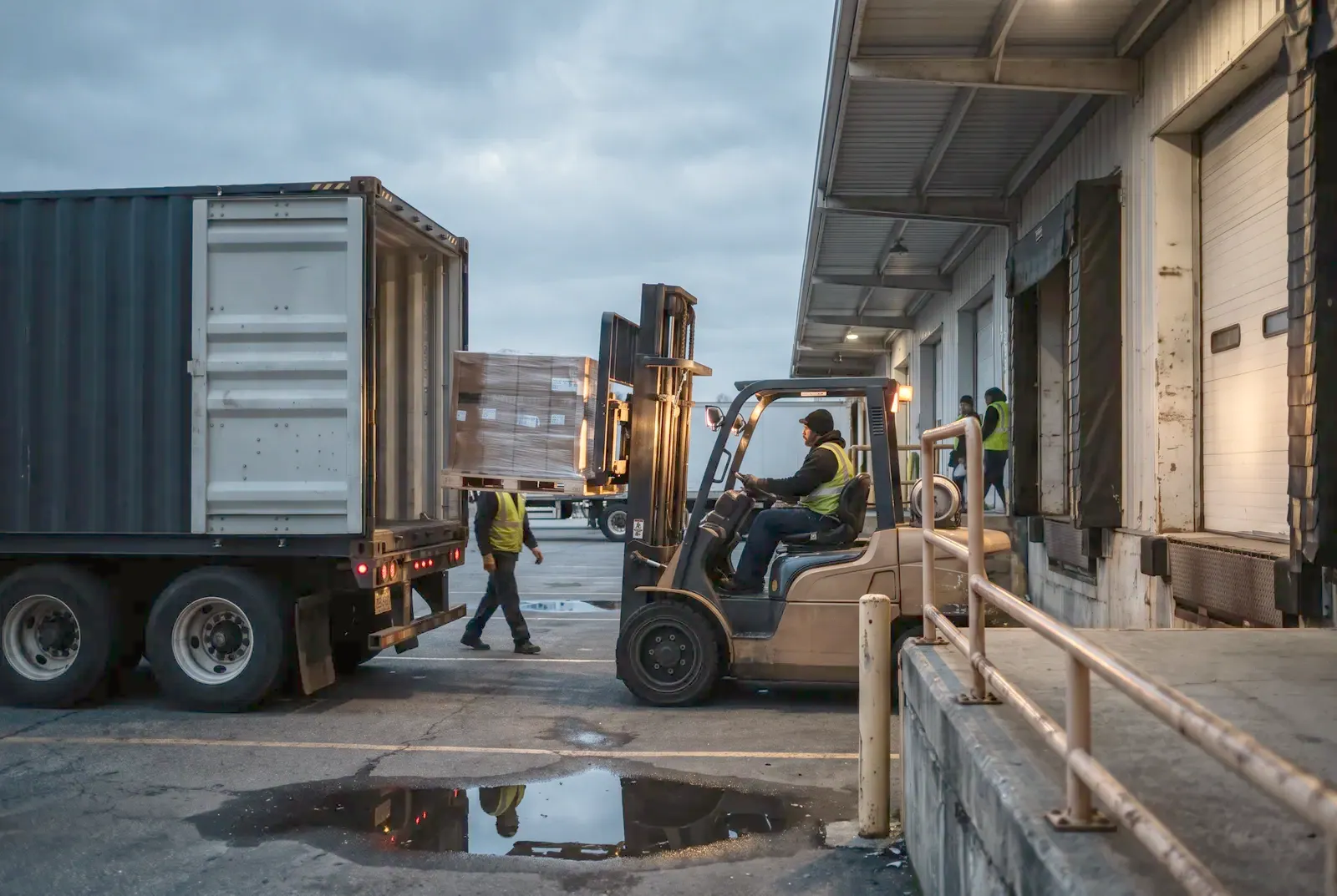 Forklift unloading pallets at a distributor's dock